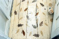 floor in the olson house with painted leafs